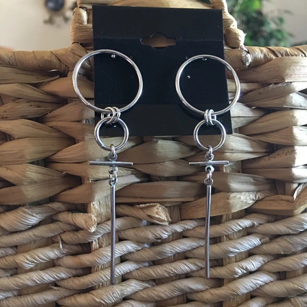 Silver tone dagger tassel pierced earrings
